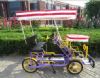 purple color two seat tandem bicycle with kids